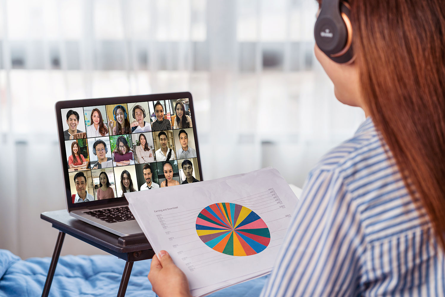 female working remotely from home on a video conference call