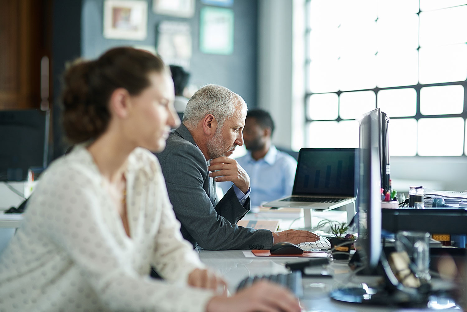 employees on computers at work