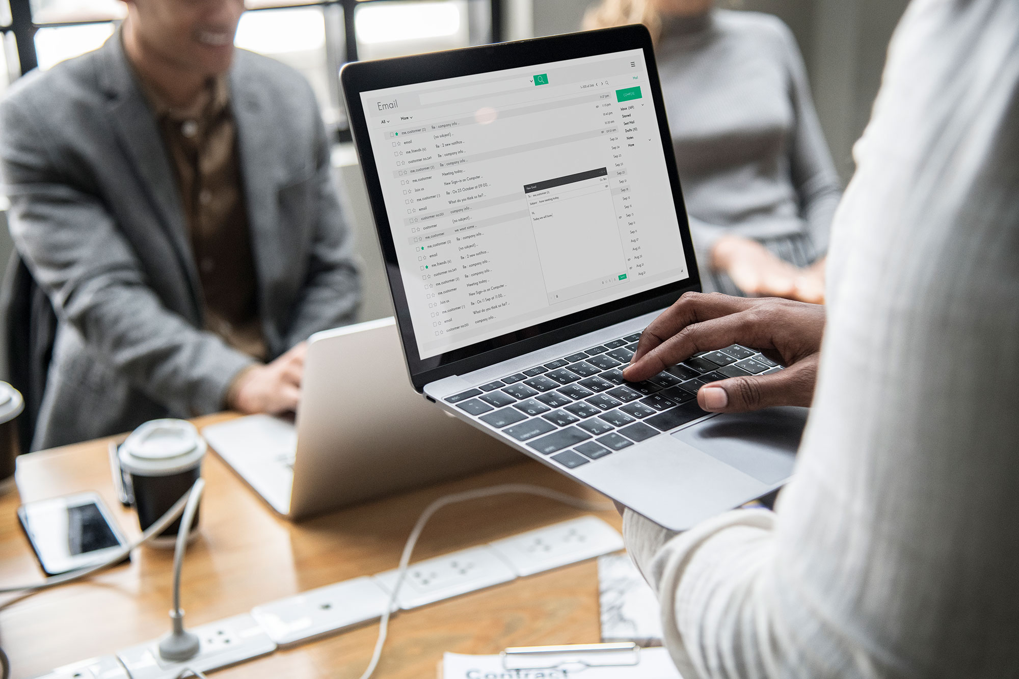 man checking email on laptop